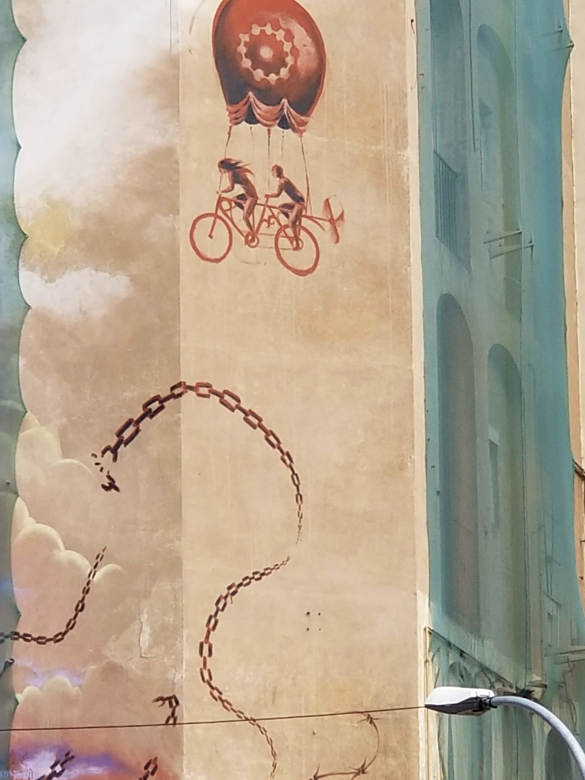 a bicycle built for two propels a balloon in the air through an old city. Imagine where you can go